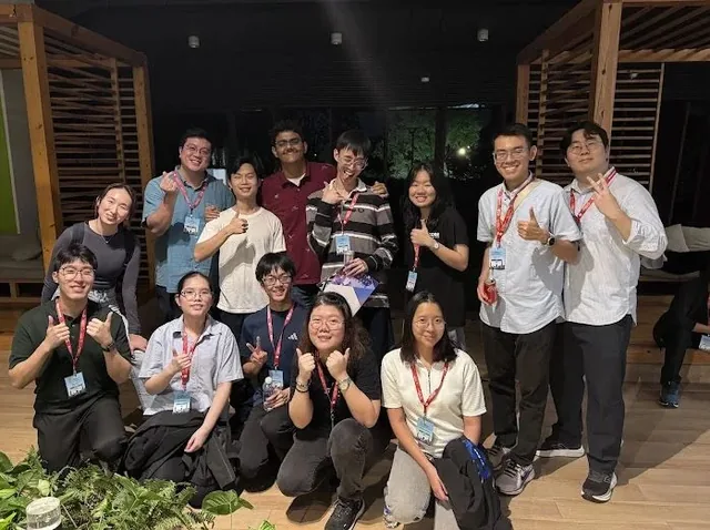 Team Singapore's GCC 2026 participants and trainers posing together after the camp
